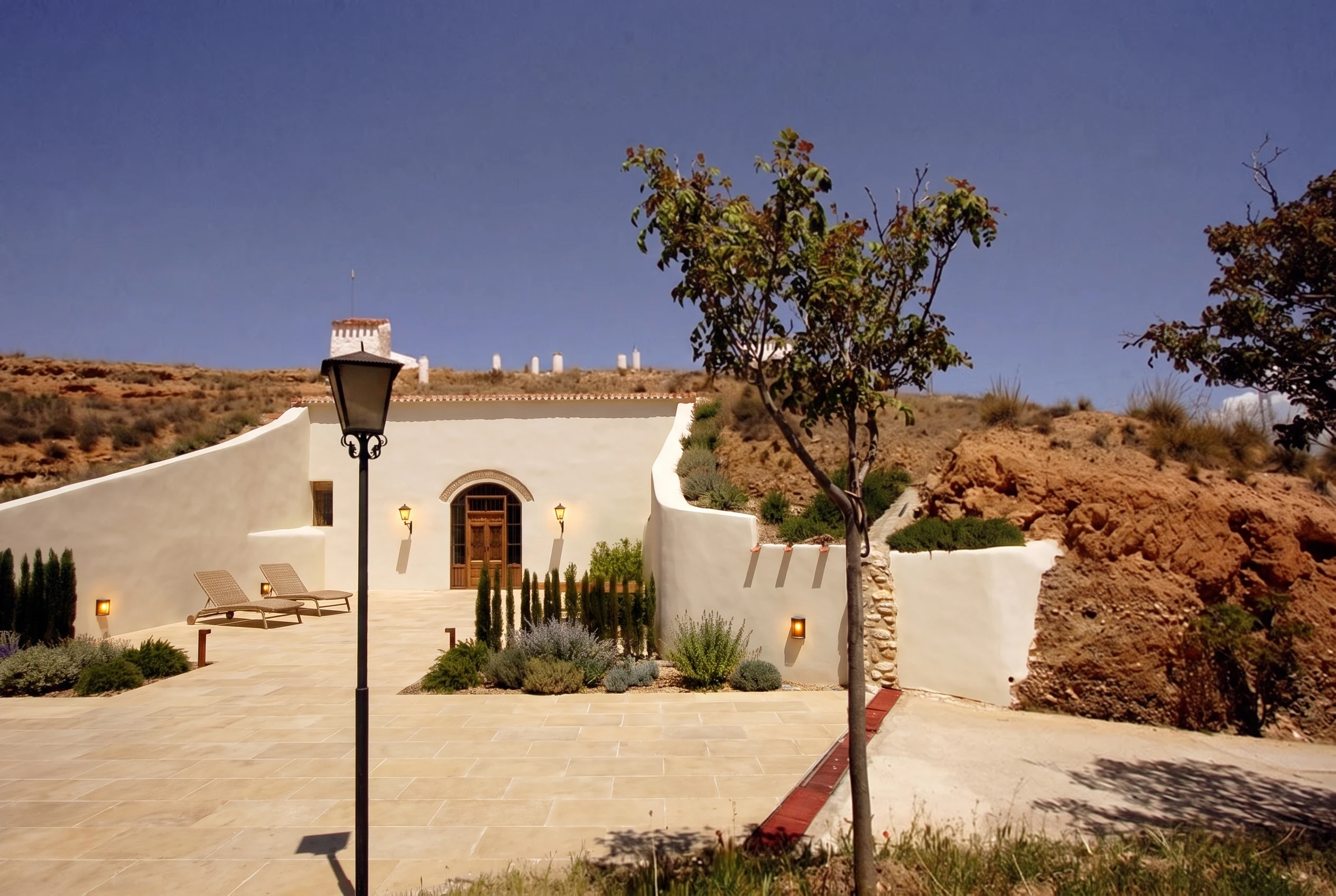Casas Cueva La Tala — complete exterior restoration: proposed renovation, AI-generated concept